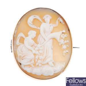 Three cameo brooches and a silver brooch.