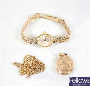 A 9ct gold sovereign lady's quartz wristwatch and a 9ct locket on yellow metal chain