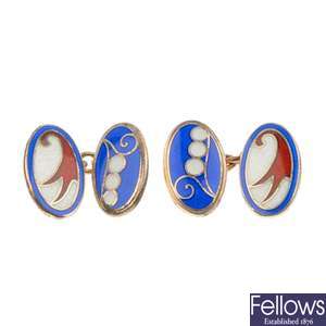 Two pairs of silver enamelled cufflinks.