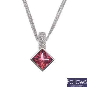 A tourmaline and diamond pendant with double barley link chain.