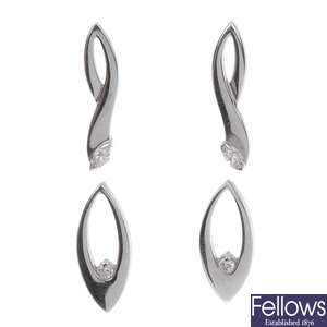 Two pairs of platinum diamond set earrings.