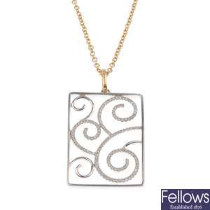 18ct white gold openwork diamond pendant on a 18ct yellow gold fine link chain.