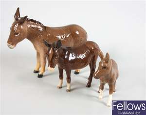 A Beswick figure of the Beatrix Potter character 'Tom Kitten', three Bewick donkeys and a foal