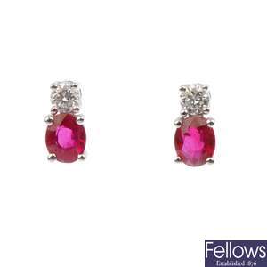 A pair of ruby and diamond stud earrings.