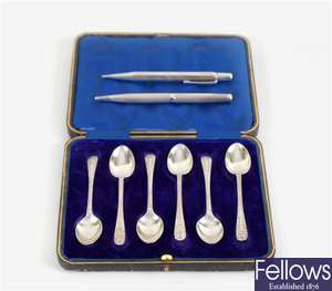 A cased set of six Sheffield 1912 hallmarked silver teaspoons, propelling pencils and a sailing junk