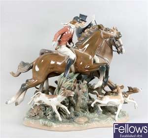 A large Lladro porcelain figure group modelled as a fox hunting group