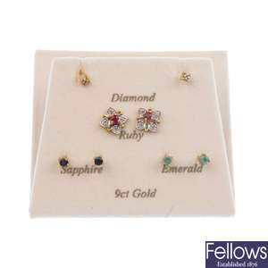 A pair of floral cluster earrings, with interchangeable centres.