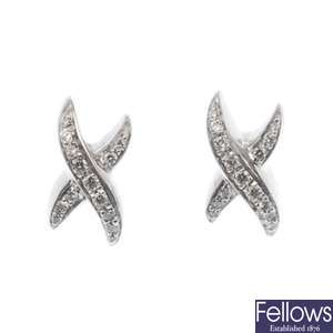 18ct white gold diamond crossover design earrings.