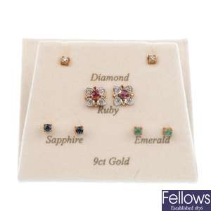 A pair of diamond cluster earrings with interchangeable centres.