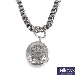 Two silver lockets and a collar.