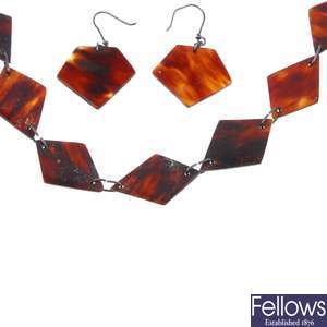 A tortoishell necklace with matching earrings.