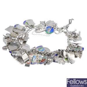 Seven silver and white metal charm bracelets.