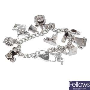Seven silver and white metal charm bracelets.
