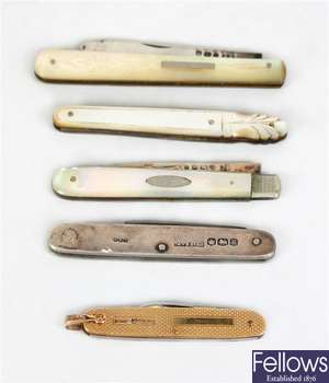 A 9ct gold cased twin bladed folding knife and two similar folding knives