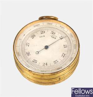 A late 19th century gilt metal cased pocket barometer