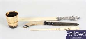 A late 19th century letter knife, a horn letter knife and folding spoon