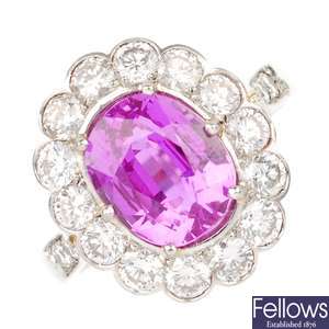 A platinum pink sapphire and diamond ring.