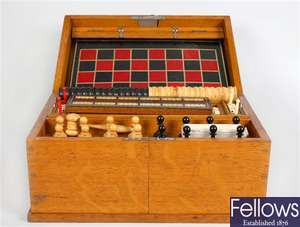 An early 20th century Staunton chess set and games compendium