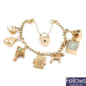 A silver gilt bracelet with 9ct gold charms.