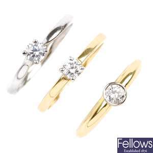 Two 18ct gold diamond single-stone rings and a platinum paste ring.