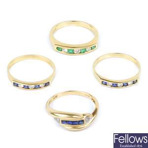 A group of four 9ct gold gem set rings.
