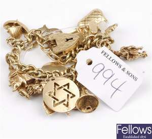 (44389) A 9ct gold charm bracelet