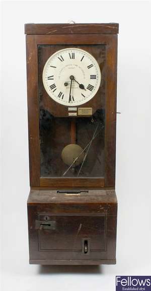 A Gledhill Brook wall hanging stained wooden cased time recording clock and clock card holder