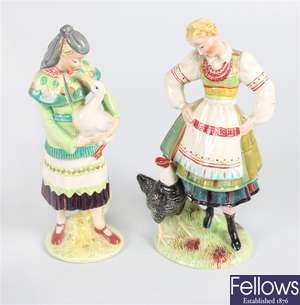 A Beswick figurine modelled as a lady holding a goose and a figurine of a lady with a black rooster
