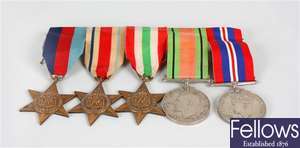A set of five WWII medals and a WWI Victory medal
