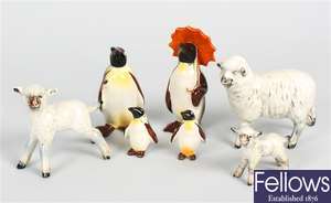A Beswick study of a penguin, four similar examples and three Beswick studies of sheep