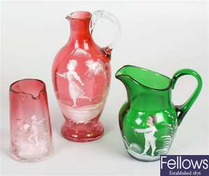 Six coloured glass jugs