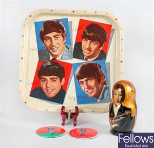 A Worcester Ware pressed metal tray printed with portraits of The Beatles & Beatles Matryoshka doll