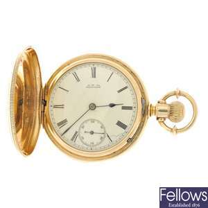 An 18k gold keyless wind full hunter pocket watch with chain and Half-Sovereign.