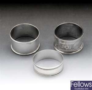 Victorian silver napkin ring & two later examples.