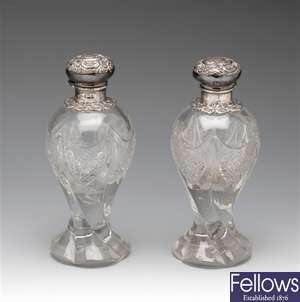 Pair of Edwardian silver mounted glass vanity bottles.