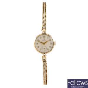 A 9ct gold manual wind lady's Rolex Precision bracelet watch.