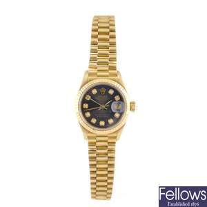 An 18k gold automatic lady's Rolex bracelet watch.