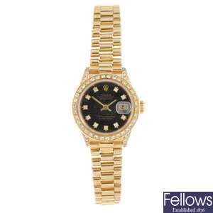 An 18k gold automatic afterset lady's Rolex Datejust bracelet watch.