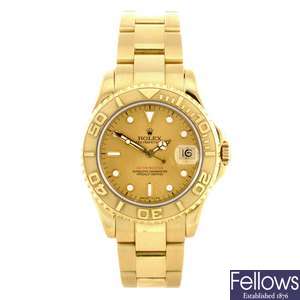 An 18k gold automatic mid-size Rolex bracelet watch.