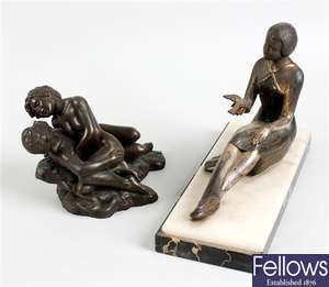 A 20th century cast spelter figure modelled as a seated young lady and another figure