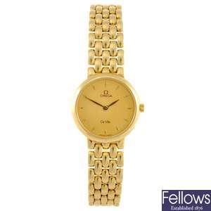 An 18k gold quartz lady's Omega De Ville bracelet watch.