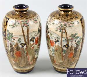 A pair of early 20th century oriental pottery vases
