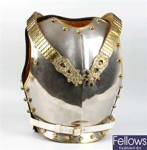A 20th century polished steel and brass cuirass