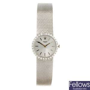 An 18k white gold manual wind lady's Rolex bracelet watch.