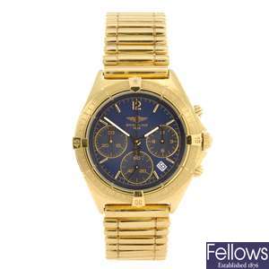 An 18k gold quartz gentleman's Breitling Chronomat bracelet watch.