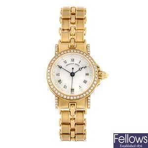 An 18k gold automatic lady's Breguet Marine bracelet watch.
