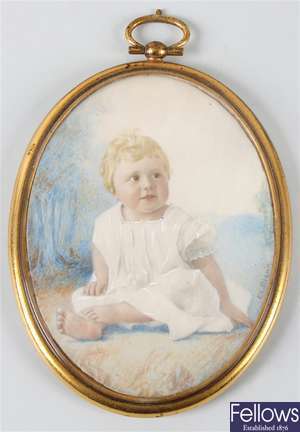 An early 20th century oval painted portrait miniature upon ivory panel