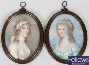 A pair of 19th century oval painted portrait miniatures