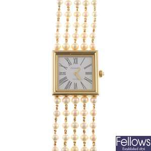 An 18k gold quartz lady's Chanel bracelet watch.