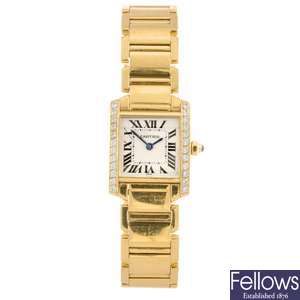 An 18k gold quartz lady's Cartier Tank Francaise bracelet watch.